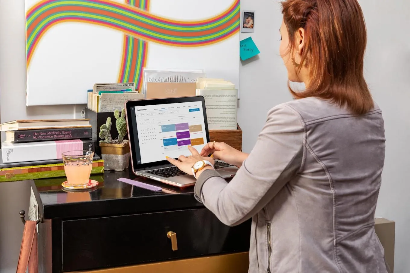 Woman checking her Square Dashboard on computer